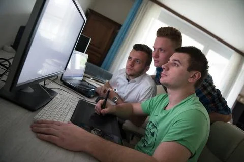 A group of graphic designers at work a group of young graphic designers wo... Stock Photos