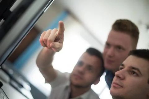 A group of graphic designers at work a group of young graphic designers wo... Stock Photos