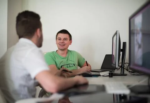 A group of graphic designers at work a group of young graphic designers wo... Stock Photos
