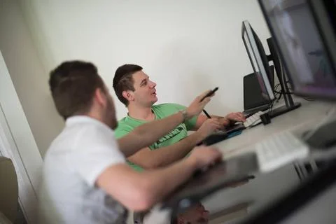 A group of graphic designers at work a group of young graphic designers wo... Stock Photos