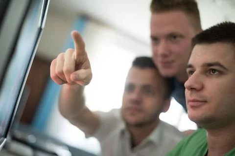 A group of graphic designers at work a group of young graphic designers wo... Stock Photos