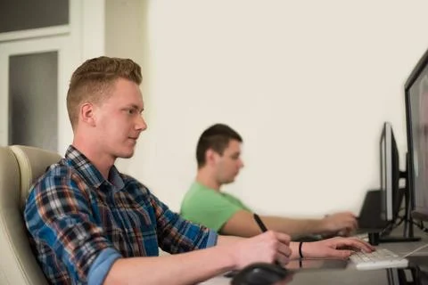 A group of graphic designers at work a group of young graphic designers wo... Stock Photos