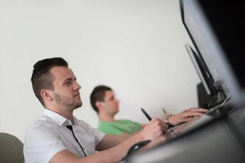 A group of graphic designers at work a group of young graphic designers wo... Stock Photos