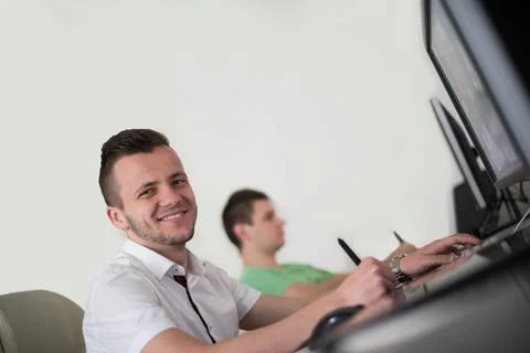 A group of graphic designers at work a group of young graphic designers wo... Stock Photos
