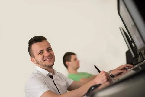 A group of graphic designers at work a group of young graphic designers wo... Stock Photos