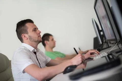A group of graphic designers at work a group of young graphic designers wo... Stock Photos