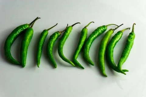 Group of green chilly on the table Stock Photos