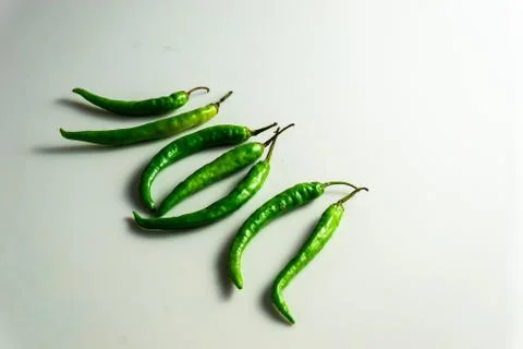 Group of green chilly on the table Stock Photos