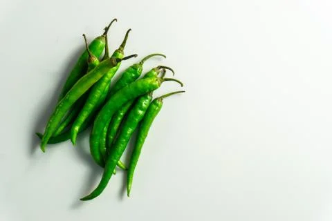 Group of green chilly on the table Stock Photos