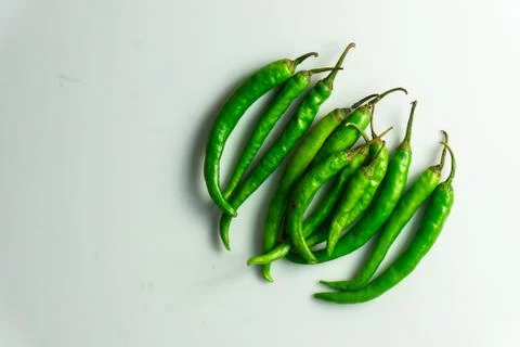 Group of green chilly on the table Stock Photos