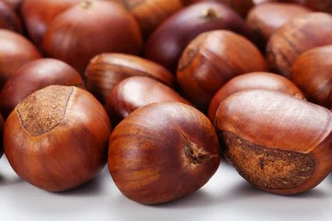Group of grilled chestnuts. Isolate on white background. Stock Photos