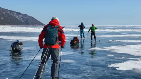 A group of guys ice skating on the ice of frozen Lake Baikal Video stock 151136142