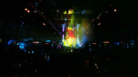 Group of guys sing and dance on stage at night club Stock Footage