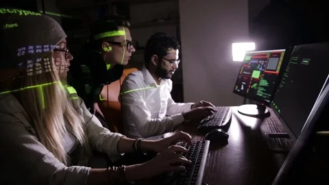 Group of hacker using computer code in dark Stock Footage 69794132