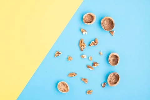 Group of halves of walnut on blue background Stock Photos