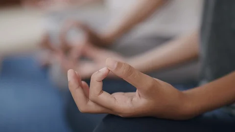 Group of Hand doing yoga exercises with lotus while sitting on yoga mats Stock Footage 127727220