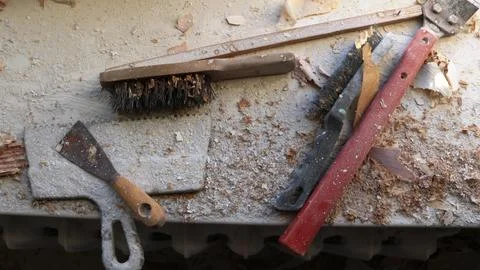 Group of hand tools among construction debris Stock Photos
