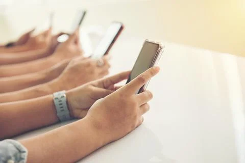 Group of hands people using and looking at mobile phone Stock Photos