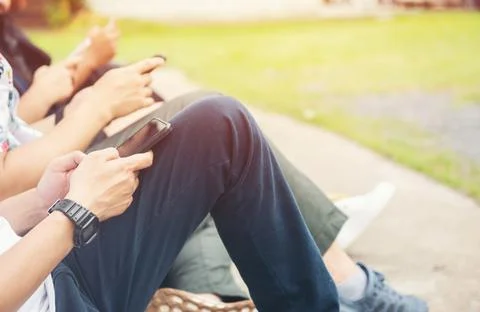 Group of hands people using and looking at mobile phone Stock Photos