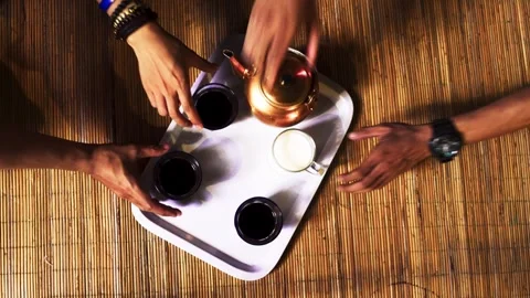 Group of Hands Reaching for Coffee and Milk Stock Footage 345551303