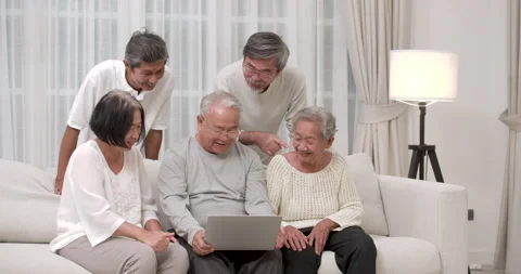 A Group of happy Asian seniors discussing about process of using computer. Stock Footage