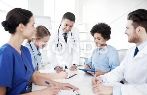 Group of happy doctors meeting at hospital office Stock Photos