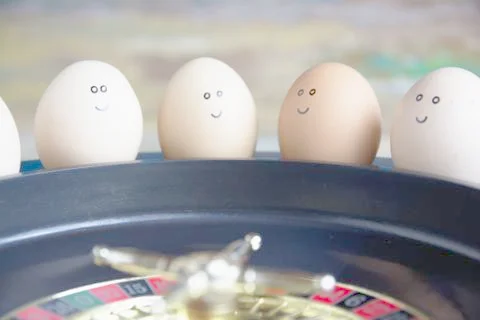 Group of happy eggs (friends ) make bets gambiling in the toy casino. Stock Photos