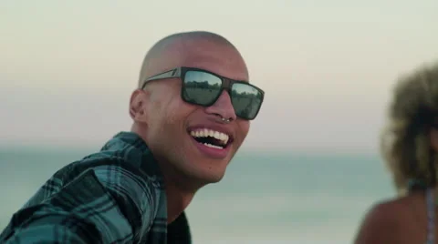 Group of happy friends playing guitar and singing on Ipanema beach Stock Footage 59378218