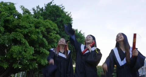 Group happy graduates students throw their caps into the air Video stock 197989989