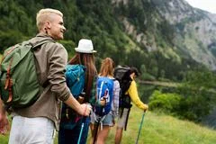 Group of happy hiker friends trekking as part of healthy lifestyle