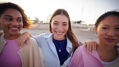 Group of happy multi-ethnic young people in a row smiling and embracing looking Stock Footage 274316631
