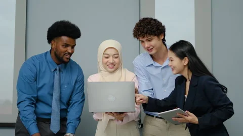 Group of happy multicultural architect business team meeting using a laptop Stock Footage 289867701