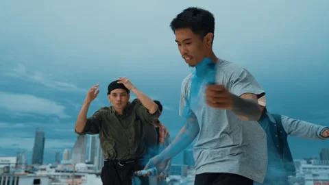 Group of happy multicultural hipster playing color flare at rooftop. hiphop. Stock Footage 257886954