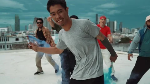 Group of happy multicultural hipster playing color flare at rooftop. hiphop. Stock Footage 271080435