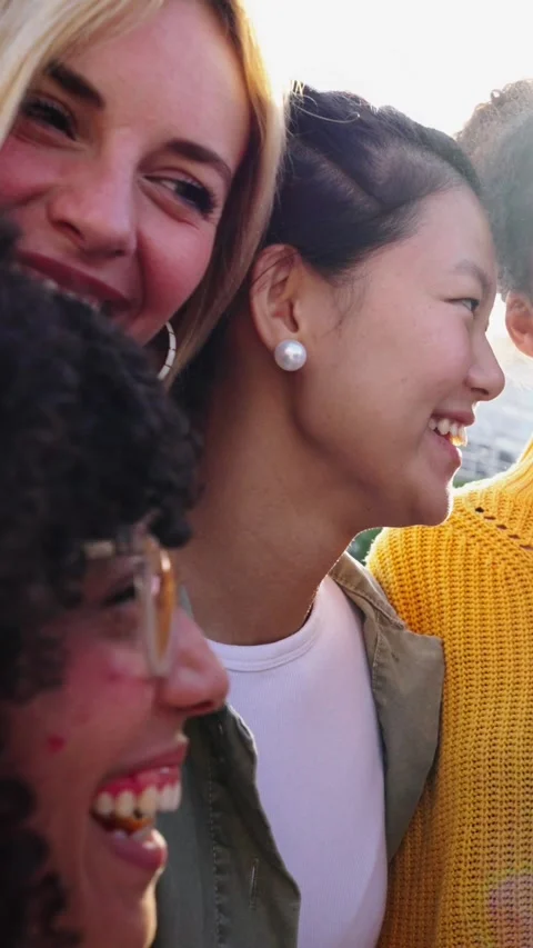 Group of happy multicultural young only women standing hugging laughing having Stock Footage 277121546