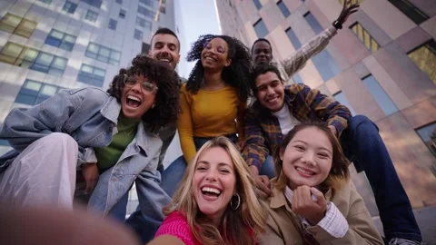A group of happy people is sharing a fun moment. Young friends take a selfie Stock Footage 266801384