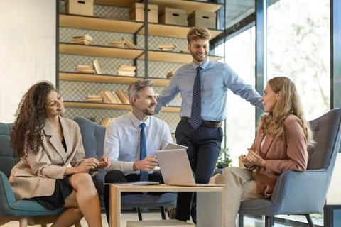 Group of happy progressive business people working on startup together at cre Stock Photos