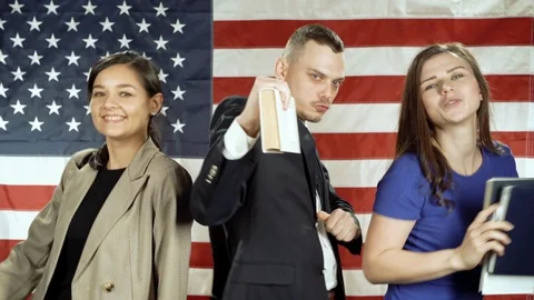 Group of happy students dancing on the background of the American flag Stock Footage 119570146