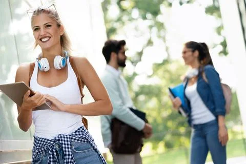 Group of happy students studying, preparing together for exam ourdoor Stock Photos