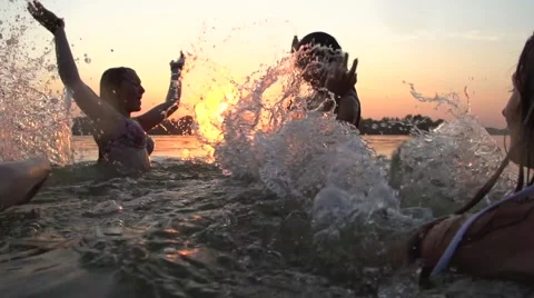 Group of happy teen girls playing in wat... | Stock Video