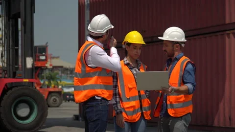 Group of harbor worker with foreman talking on the walkie-talkie control load Stock Footage 159394850