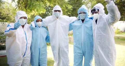 Group of healthcare workers in full body protective equipment outdoors Stock Footage 146115853