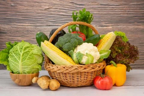 Group Healthy assorted fresh vegetable in a wooden basket, With vitamins c fr Stock Photos