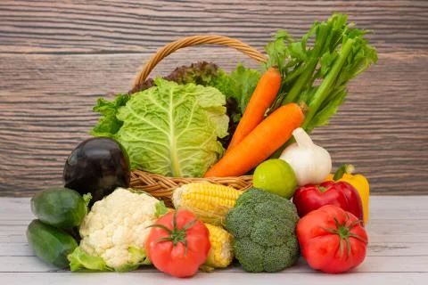 Group Healthy assorted fresh vegetable in a wooden basket, With vitamins c fr Stock Photos