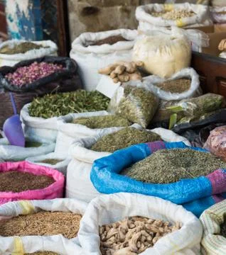 The group of herbs in the grocery with selective focus at blue bag Stock Photos