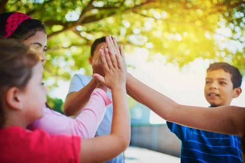 Group, high five and students with team building, school and support with Fotos de archivo