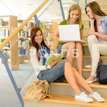 Group of high school classmates study library Stock Photos
