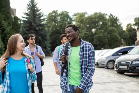 Group of high school students talking and laughing Stock Photos