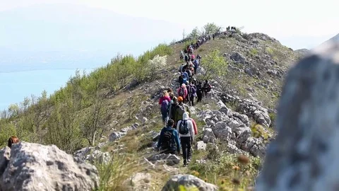 A group of hikers approaching the mountain peak Stock Footage 79787950