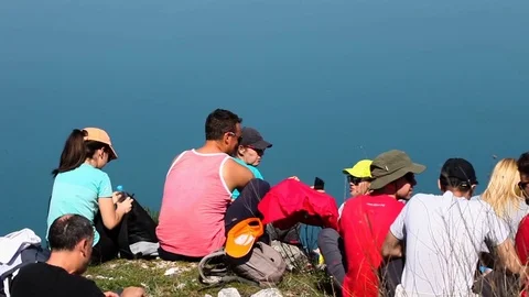 Group of hikers having a lunch on the mountain peak Stock Footage 79793093